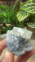 Raw fluorite cube on matrix