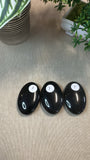 Obsidian palm stones