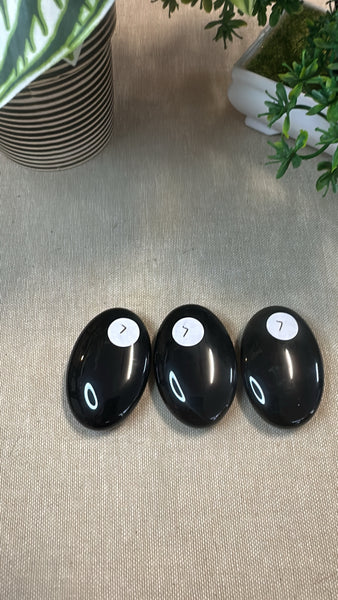 Obsidian palm stones