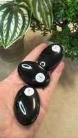 Obsidian palm stones