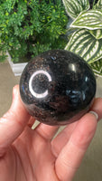 Firework stone with garnet sphere