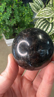 Firework stone with garnet sphere