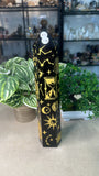 Obsidian tower with gold etchings