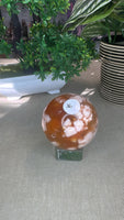 Red flower agate sphere