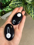 Obsidian palm stones