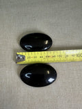 Obsidian palm stones