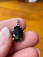 Faceted store moldavite pendant